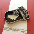 Black and Chrome 101st Airborne Division Metal Auto Emblem on a red and white background