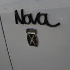 Black and Chrome 10th Mountain Division Metal Decal on White Car