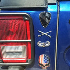 1st Cavalry Division Metal Auto Decal on Blue Car Rear Fender Also Features an Air Assault Badge and Field Artillery Branch Decals