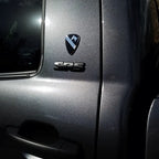 1st Cavalry Division Metal Auto Decal badge with a logo on a vehicle door