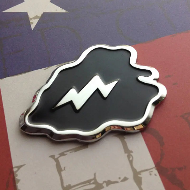 25th Infantry Division Metal Decal Black and Chrome Angled to the Left on a red, white and blue backgound