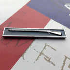 Black and Chrome Expert Infantryman Badge Metal Decal on a red, white and blue background