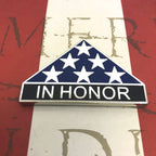 Decorative ribbon with stars and 'IN HONOR' text on a flag background