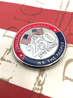 A round commemorative challenge coin celebrating the 250th anniversary of the United States, featuring red, white, and blue enamel, silver-toned metal, and American flags. The coin is displayed on a red, white, and blue distressed background.