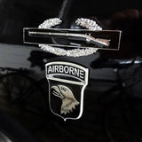 Combat Infantryman Badge Metal Car Decal First Award Airborne insignia with a rifle and wings on a dark background
