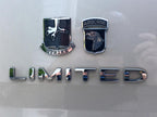 502nd Infantry Regiment Strike Metal Auto Emblem above a limietd decal on a white surface