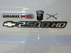 Field Artillery Branch Insignia Metal Car Emblem With Airborne Decal on a Duramax Diesel Chevy 25000HD