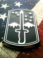172nd Infantry Brigade Metal Decal in Black and Chrome on a Red, White and Blue Background