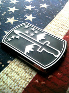 172nd Infantry Brigade Metal Car Emblem Facing the right on a red, white and blue background