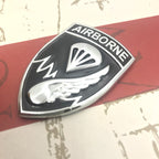 Black and  Chrome 187th Infantry Regiment Airborne Metal Car Emblem Decal on a red and white background