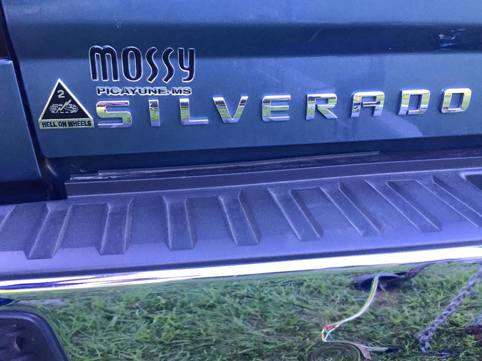 Black and Chrome Full Color 2nd Armored Division Hell on Wheels Metal Car Emblem  on a Chevy Silverado Tailgate