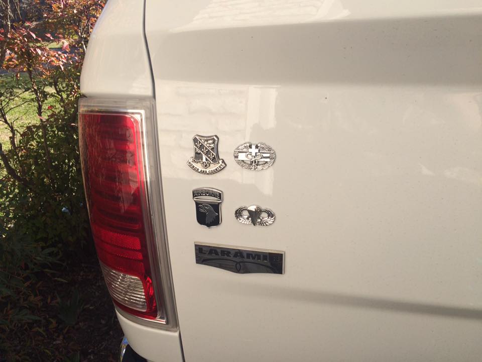 Combat Medic Badge 1st Award Metal Car Emblem With 3 more army metal decals on a white vehicle