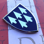 AAMDC Emblem on a red and white background
