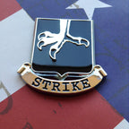502nd Infantry Regiment Strike Metal Auto Emblem on an american flag