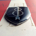 8th Infantry Division Metal Auto Emblem Zoom on Botton Tip on a red and white background