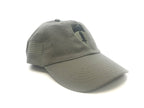 Green Berlin Brigade cap with embroidered designs on a white background