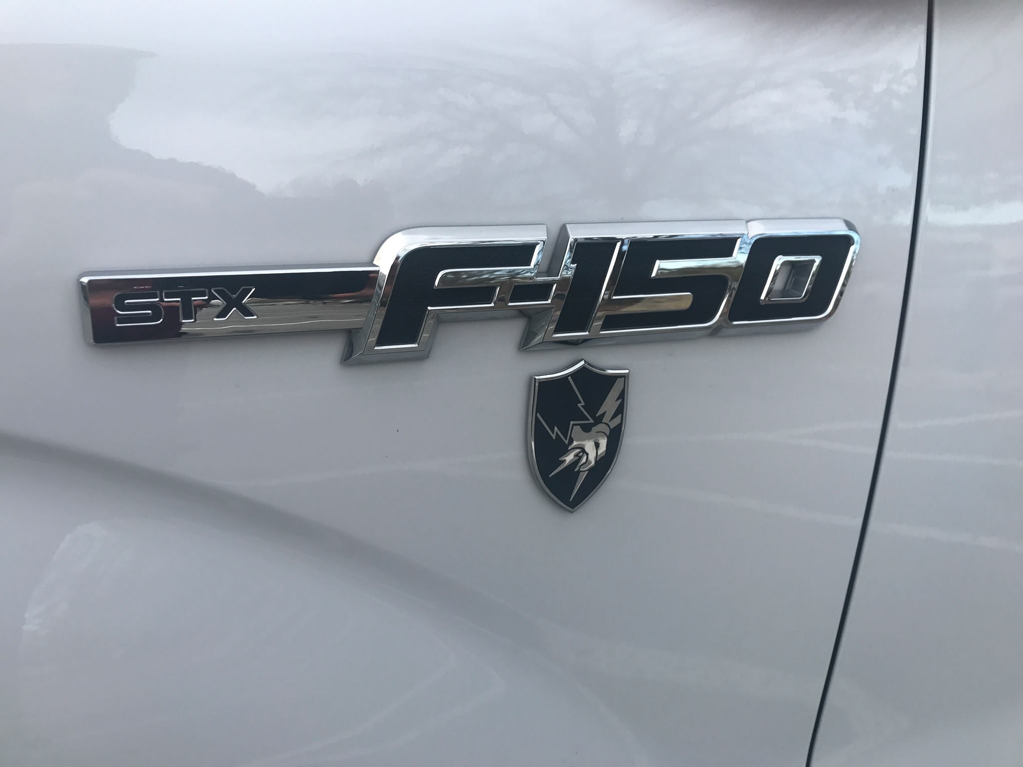 US Army Security Agency Metal Decal below f150 STX decal on a ford truck front fender