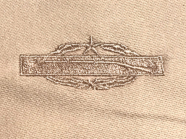Khaki hat with embroidered Combat Infantry Badge Second Award