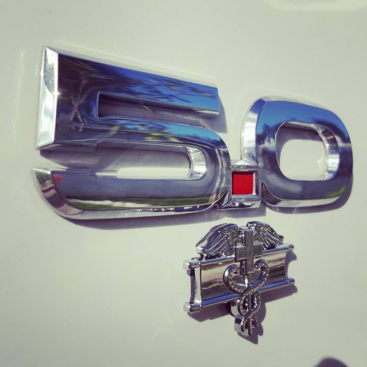 EFMB Metal Car Emblem Chrome Decal on the side of a white truck