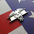 EFMB Metal Car Emblem – Army Medical Badge Chrome Decal Slanted on a Red White and Blue Background