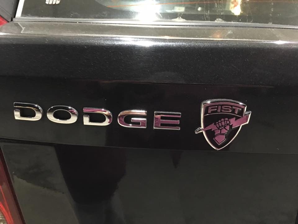 Black and Chrome Fire Support Team FIST Metal Decal on a Dodge