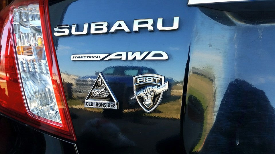 Fire Support Team FIST"Metal Decal on a Subaru rear fender