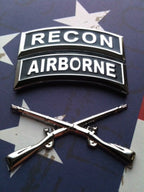 Recon and Airborne tabs with field artillery insignia badge on a red, white, and blue background