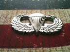 Parachutist Badge Jump Wings Metal Car Emblem on a red, white and blue background