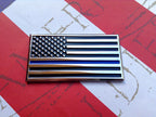 US Flag Thin Blue Line Metal Decal Black, Chrome and Blue on a Left Angle on Red White and Blue Background
