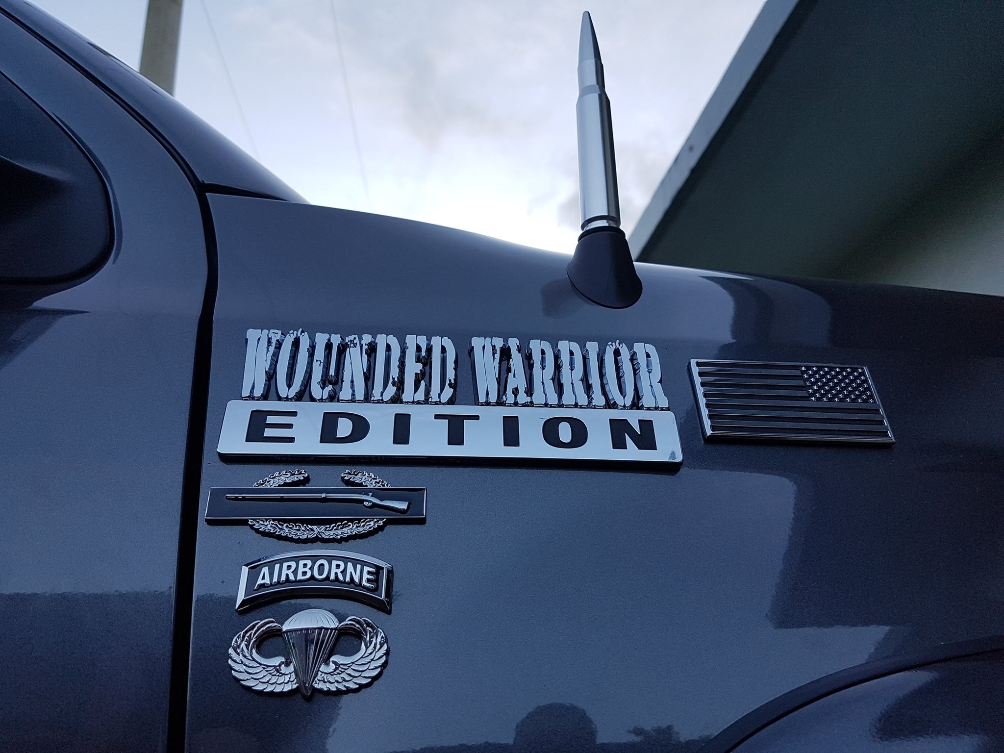 Airborne Tab Decal With CIB and Jump Wings Decal on the Fender of a Black Truck